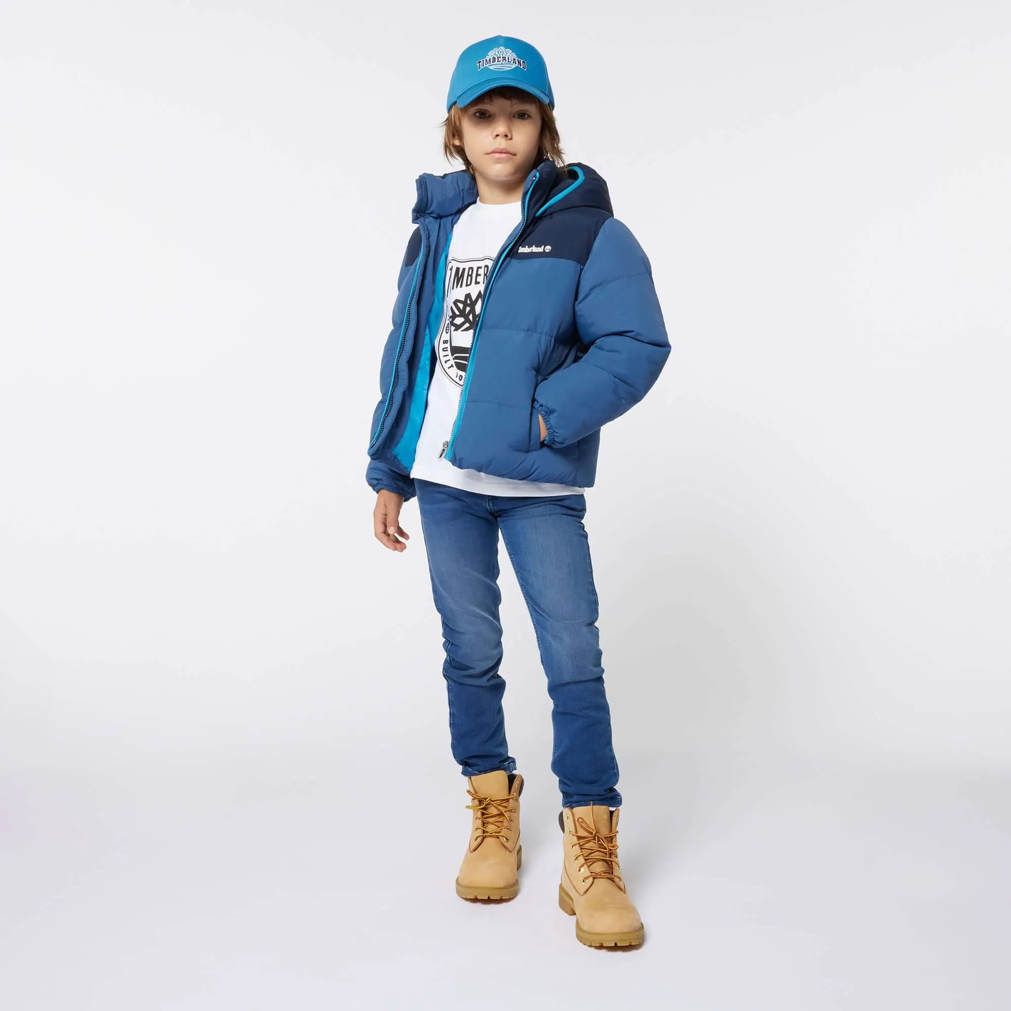 Jungen Blauer Daunenmantel