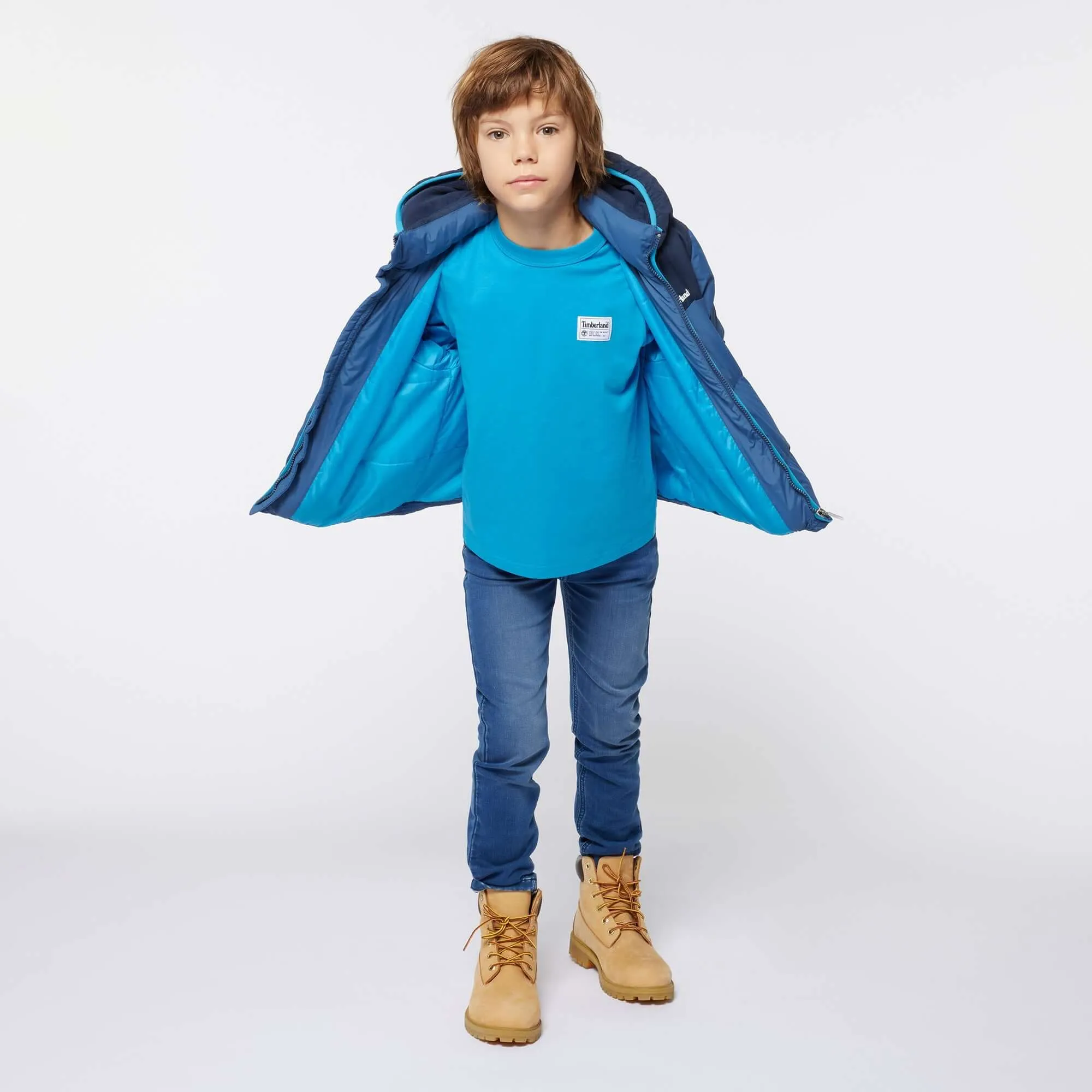 Jungen Blauer Daunenmantel